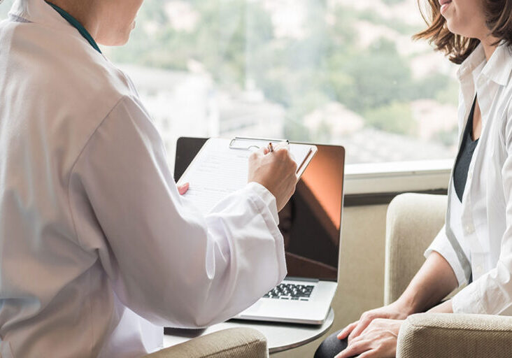 Medical professional-consulting with a patient.